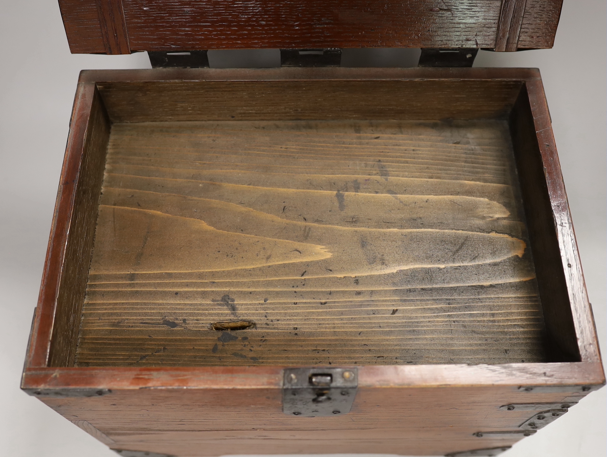 A Japanese iron mounted box, with black lacquer interior tray, box 30cm wide